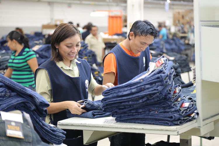 VF associates at a garment manufacturing facility in Mexico, do a final inspection of products before they are prepared for packing and shipping.