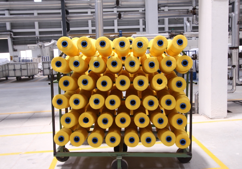 Cone dyed yellow yarns in a textile mill