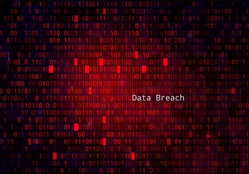 Data breach image with binary data illustration.